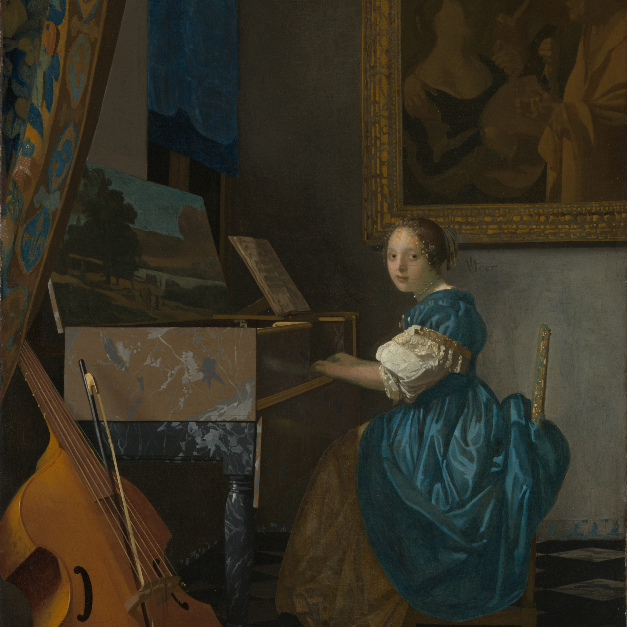 A young woman seated at a virginal